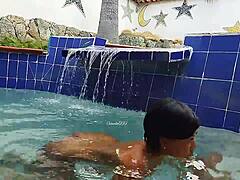 Indian mature and young Brazilian couple in the pool